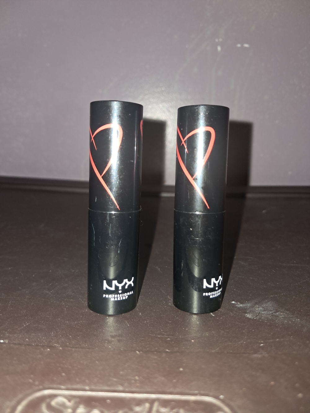 NYX Black Lipstick Tubes with Red Heart Accent
